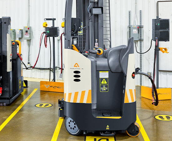 Forklift charging area in warehouse.