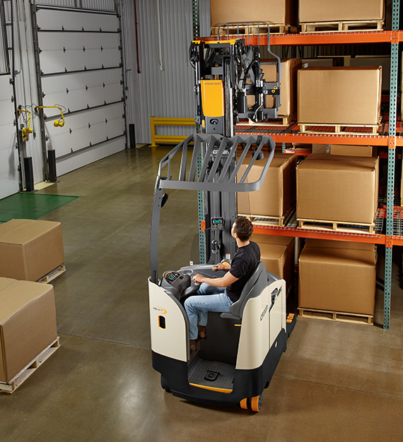 Operator utilizing the the RM/RMD sit-down reach truck increased visibility to transport loads.