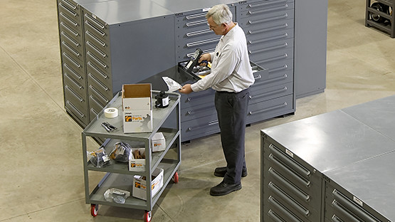 Man scans inventory of Crown replacement parts