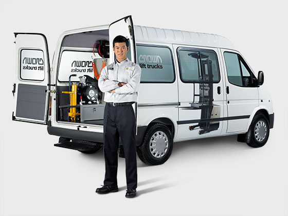 A Crown service technician with Crown service van