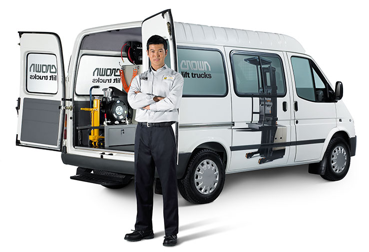 A Crown service technician with Crown service van